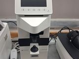 a picture of a microscope with a monitor on top of it