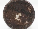 a close up of a chocolate cake with a white frosting on top