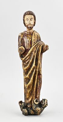 an image of a statue of a man holding a book