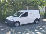 a white van that is parked on the side of the street