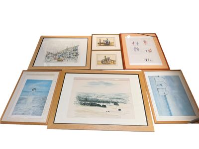 beaucoup de photos encadrées accrochées au mur
