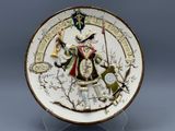 an image of a decorative plate with a man holding a sword and shield