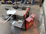 a machine that is sitting on the ground in a warehouse