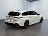 the rear end of a white car in a white room