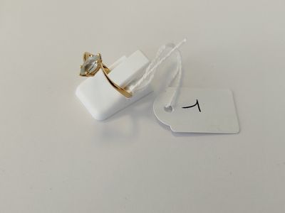 a small white box with a ring on top of it
