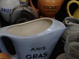 many different types of pitchers and pitchers on the table