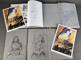 a lot of drawings and pictures on the table
