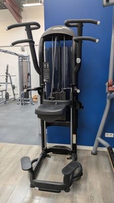 a gym equipment that is in a room with a blue wall