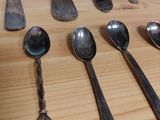 a lot of spoons and spoon spoons on the table
