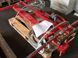 a red fire hydrant sitting on top of a wooden pallet