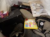 a pile of luggage and a book on the floor