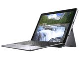 a laptop with a picture of a waterfall on the screen