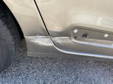 a close up of a car door with a hole in it