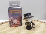 a small figurine of a man in a top hat and top hat