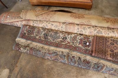 several pieces of carpet on the floor next to a dresser