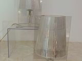 two lamps that are sitting on a table in a room