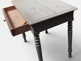 a small wooden table with a drawer on it