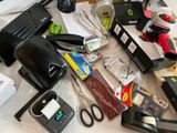 a table with a lot of office supplies on it