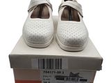 pair of women ' s white shoes in a box on a white background