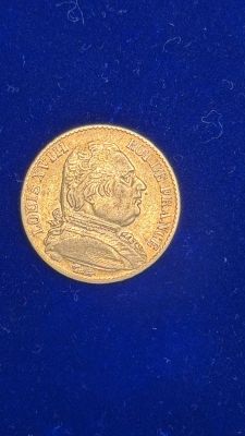 an image of a gold coin on a blue surface