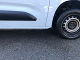 a white van parked on the side of the road