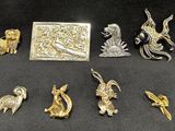 a lot of silver and gold items on a black surface