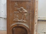 a small fire place with a statue on top of it