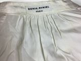 a close up of a white shirt with a label on it