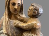 an image of a statue of a woman holding a child