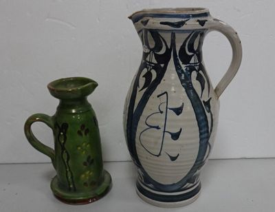 two vases sitting next to each other on a table