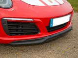 a red sports car parked on the side of the road