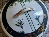 a bowl with a lid that has a design on it