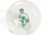 a glass bowl with a fish inside of it on a white surface