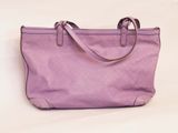 purple leather handbag on a white background