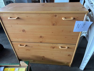 a wooden dresser that has a price tag on it