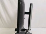 an image of a computer monitor and keyboard on a stand