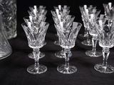a lot of wine glasses sitting on a table