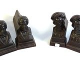 three bronze bookends of a man and a woman on a white background