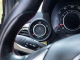a close up of a car ' s dashboard with a steering wheel