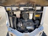 a small engine in the back of a truck