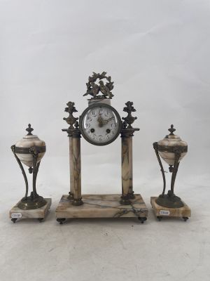 a picture of a clock and three vases sitting on a table