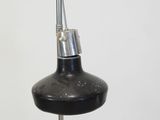 a black lamp that is on top of a table