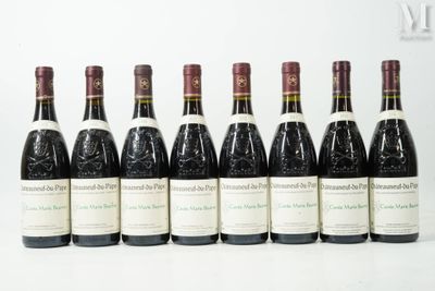 six bottles of wine are lined up in a row on a table