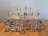 a lot of glasses sitting on a wooden table