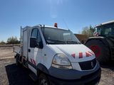 a white truck that is parked next to a tractor