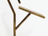 a metal chair that has a wooden seat on it