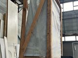 several pieces of metal are stacked on top of each other in a warehouse