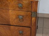 a marble top on a wooden dresser in a bathroom