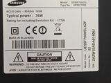 the back of a black laptop with a white label on it