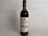 a bottle of wine that is sitting on a table